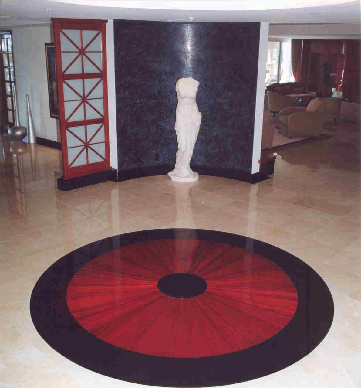 Large circular custom hardwood floor medallion inside an architectural interior